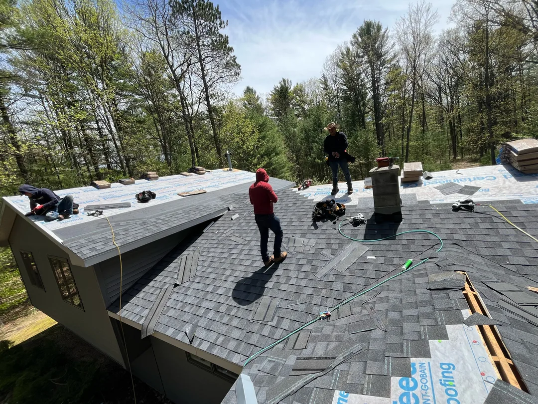 A Falcon Roofing crew installing a new shingle roof