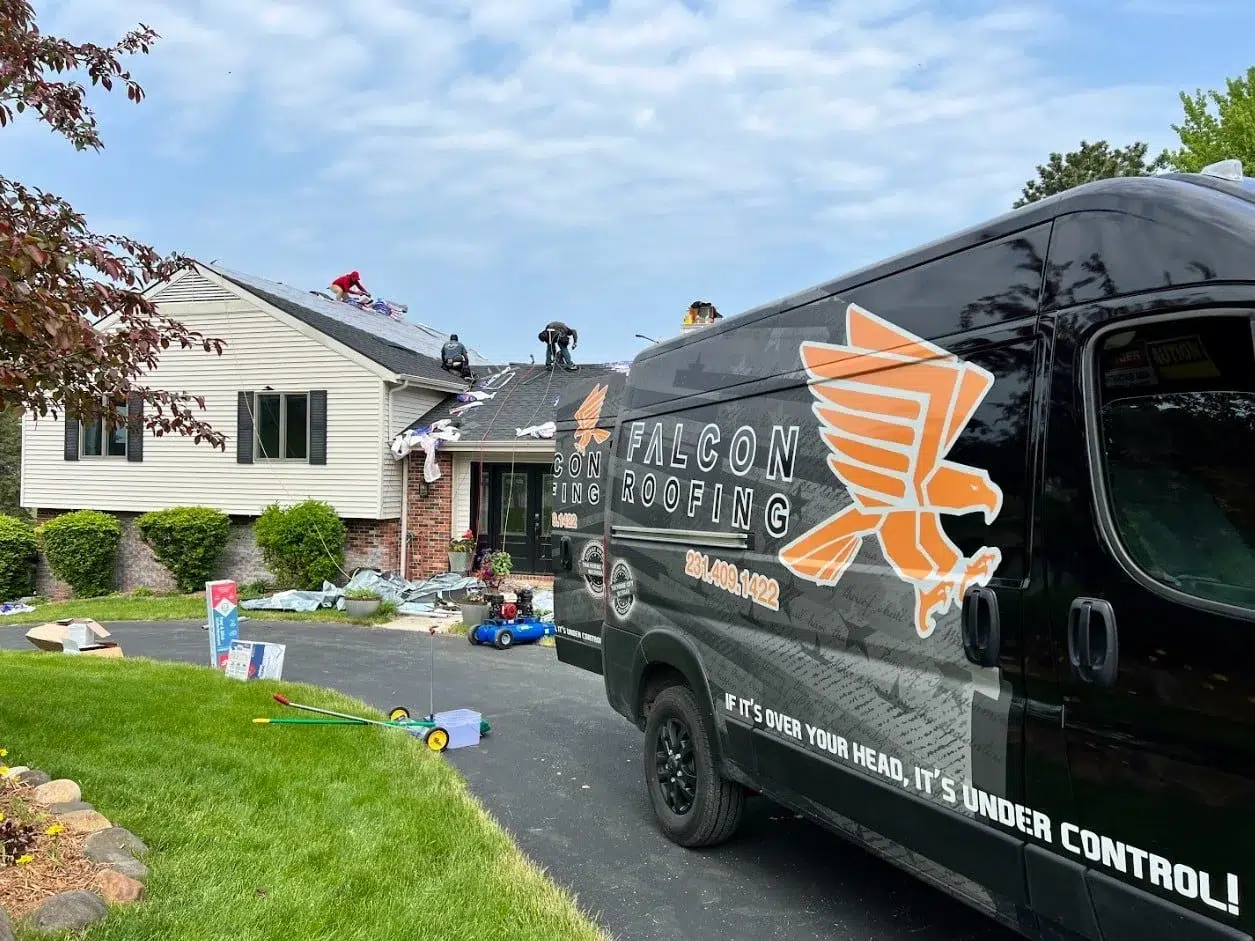 Falcon Roofing service truck and crew in Traverse City, Michigan