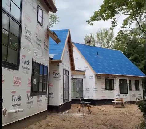 Completed roofing project by Falcon Roofing on a Charlevoix, Michigan home