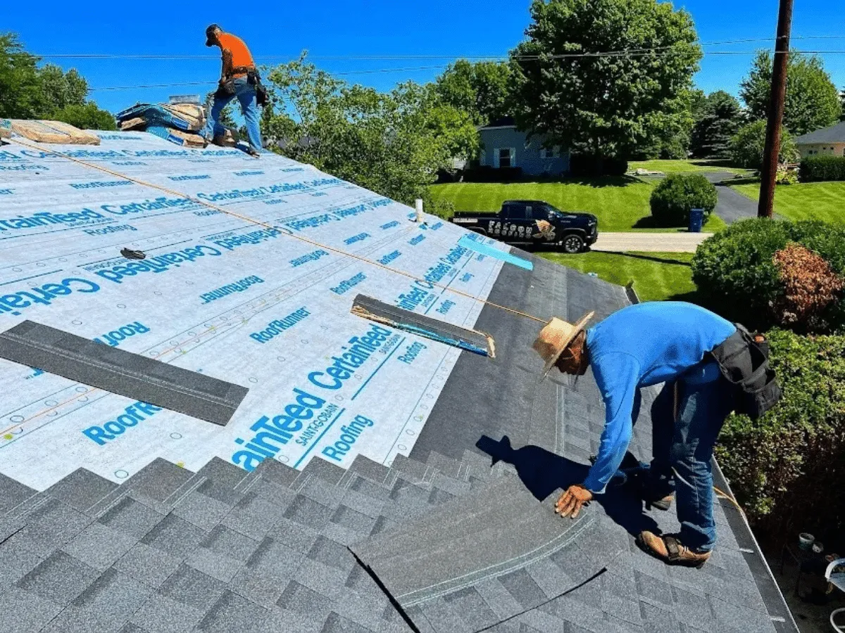 Local Falcon Roofing crew installing shingles on a Traverse City home