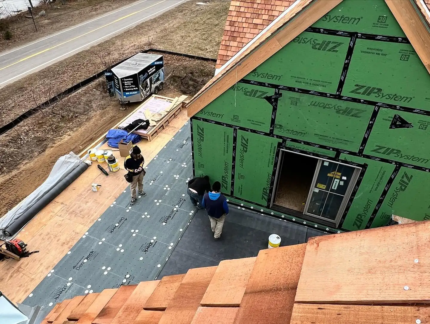 Falcon Roofing team installing a Flat (EPDM rubber) roof at Old Mission Peninsula