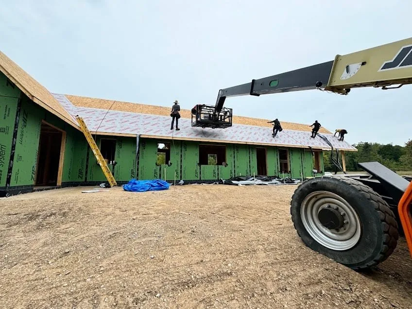 Falcon Roofing crew working on a commercial roof installation